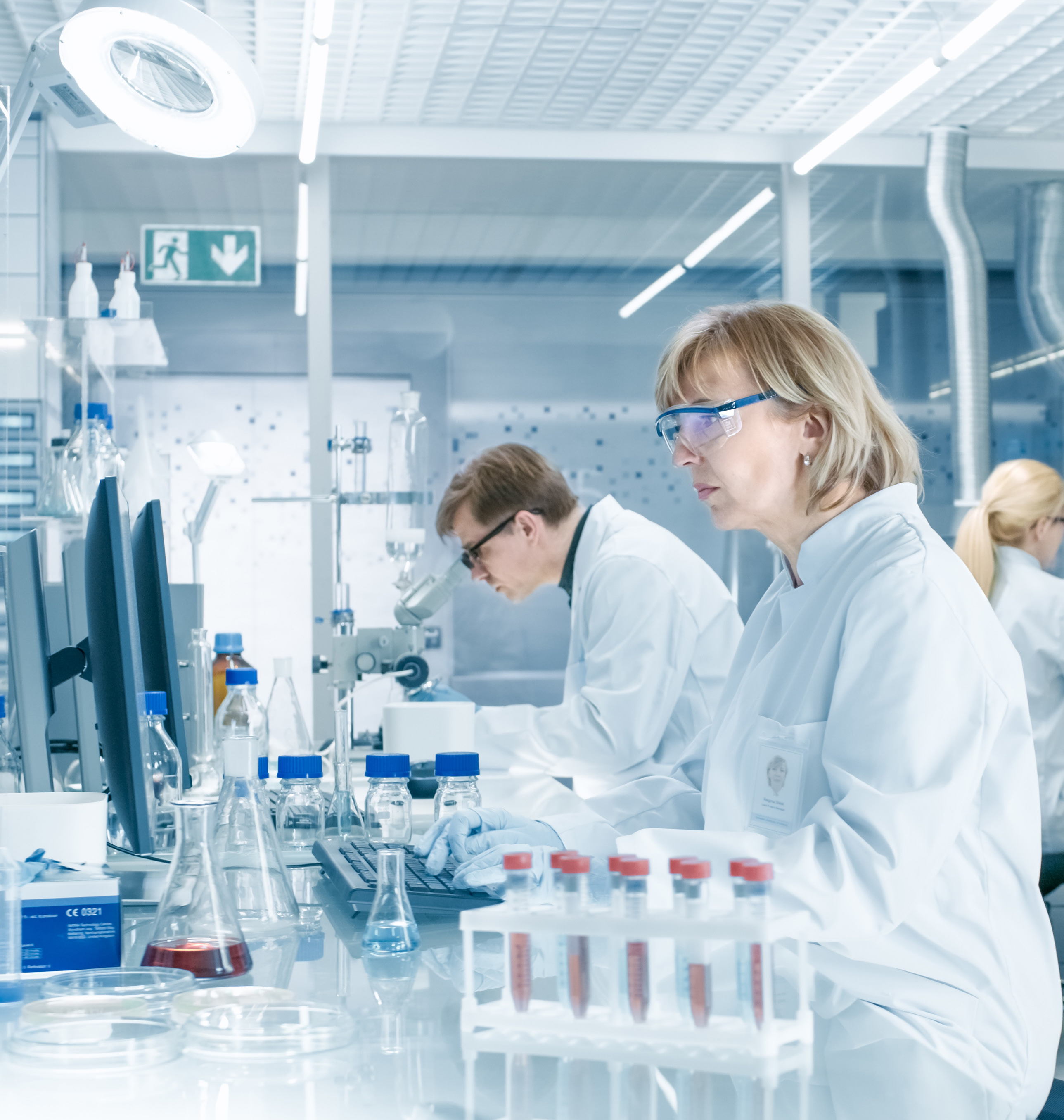 Scientists working across a laboratory