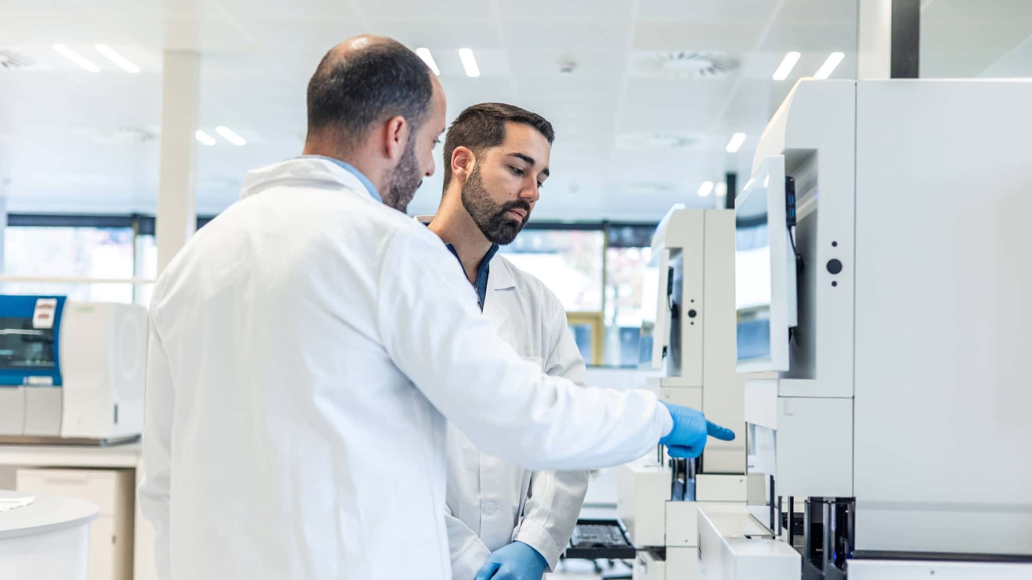 Scientists discussing laboratory equipment