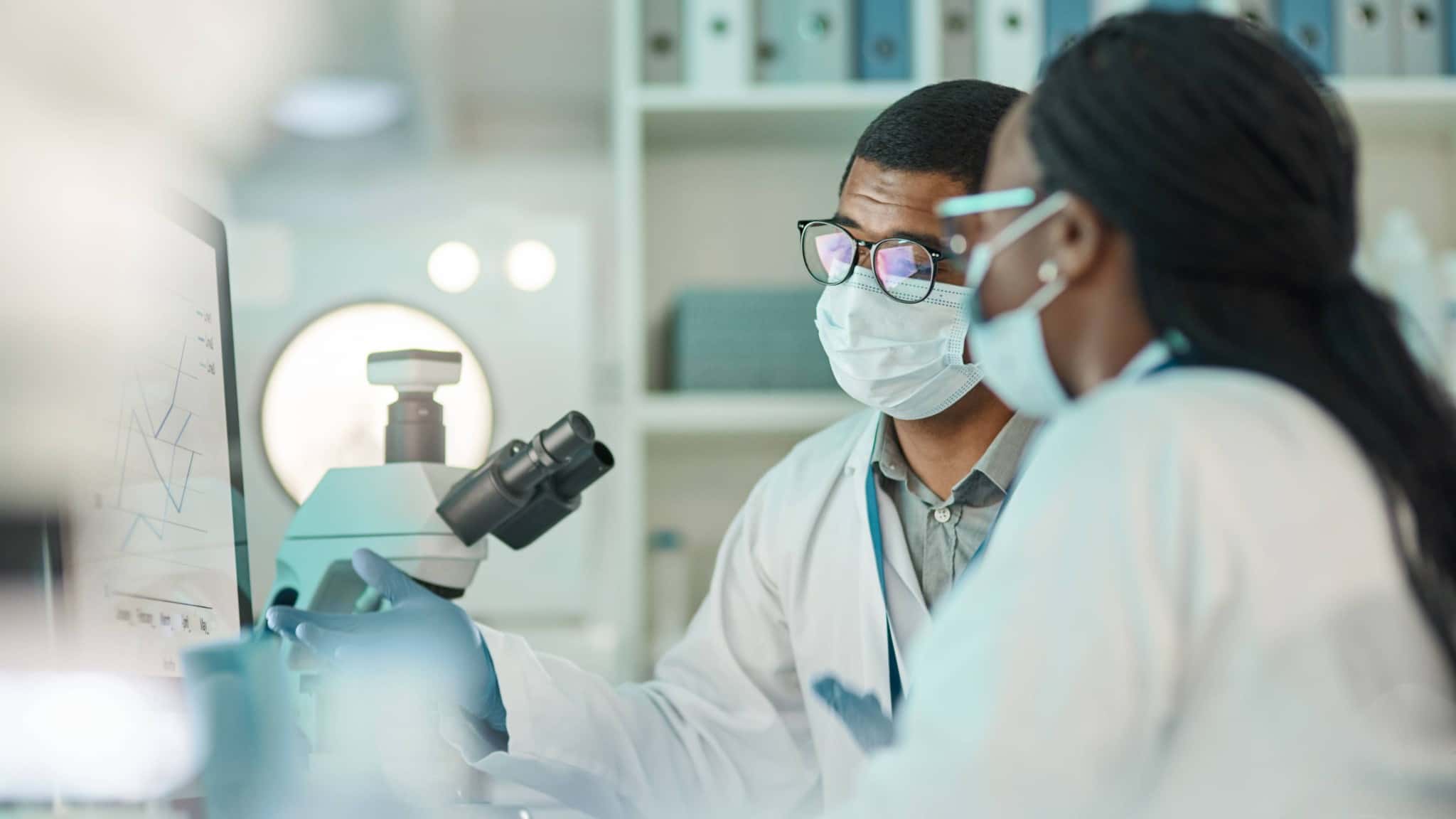 Scientists reviewing laboratory data