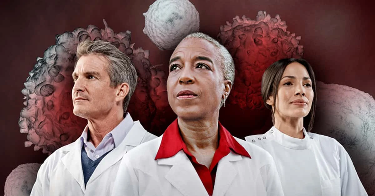 Researchers with a cancer research illustration